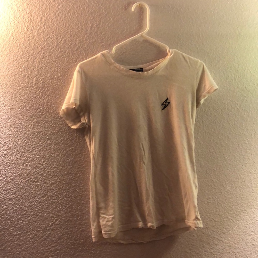 Basic white brandy top with lightning bolt patch